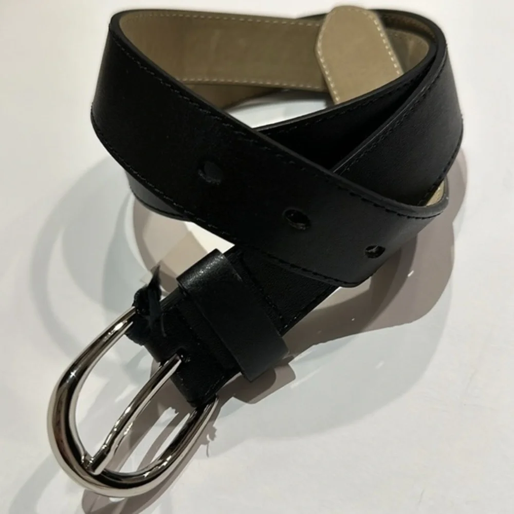 Black Vegan leather belt with silver tone buckle fits approximately 31-36”